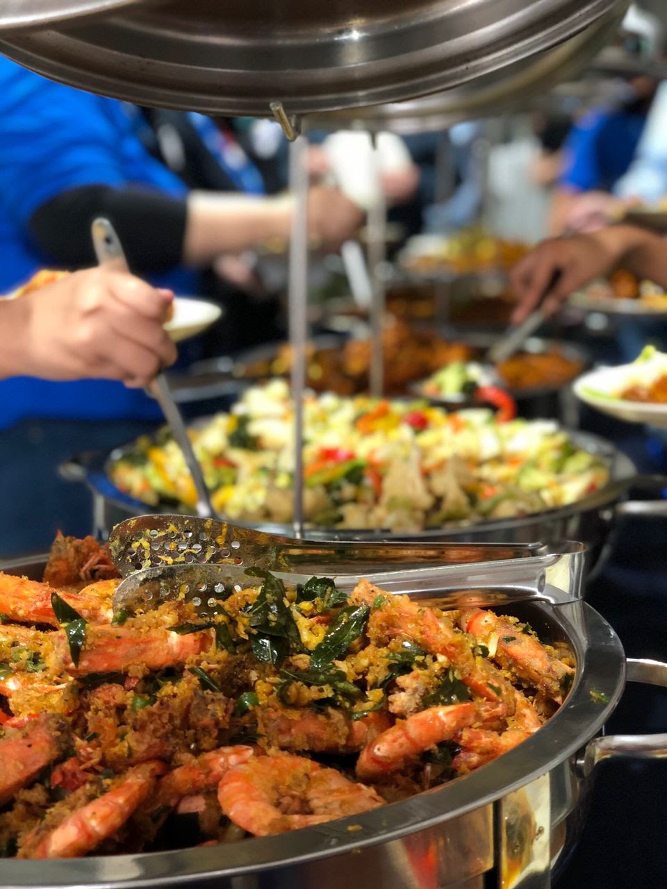 Guests helping themselves at a catered buffet