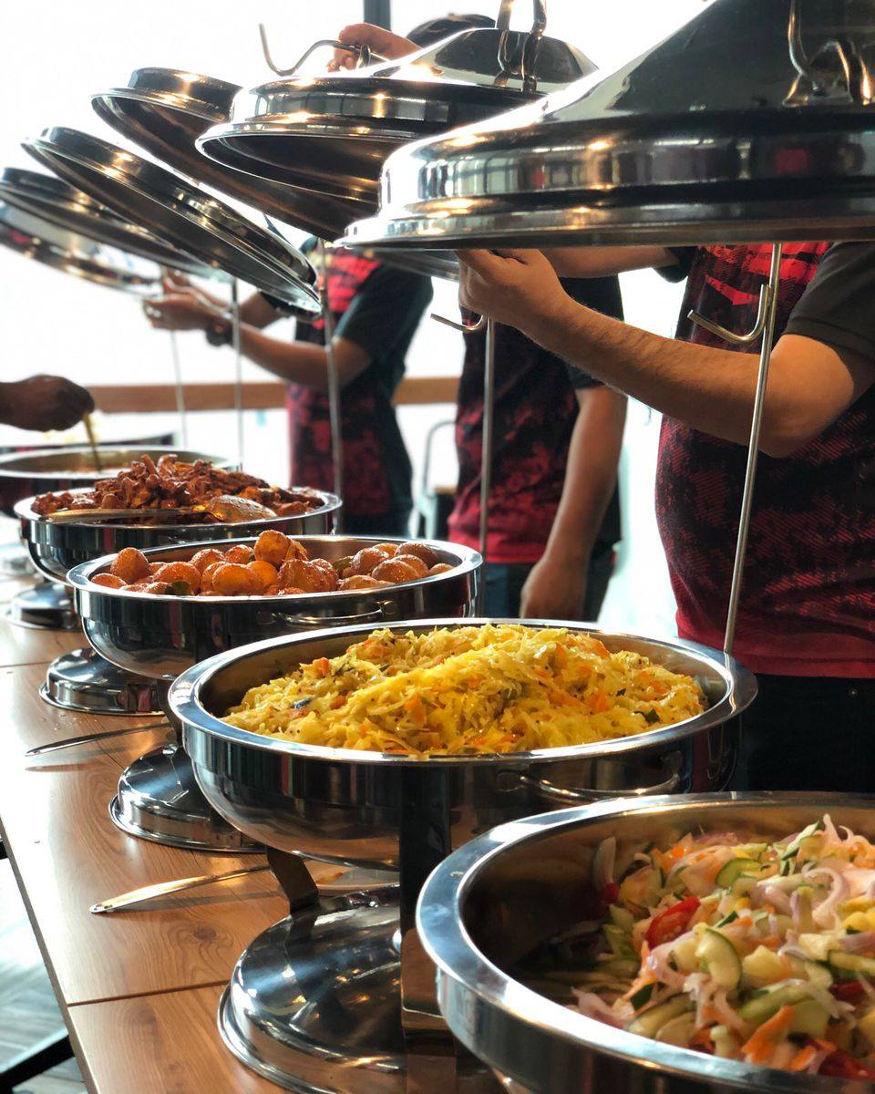 Madam Leela’s catering team at a buffet setup